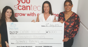 Scantec FMCG team hand over £5000 Claire House cheque