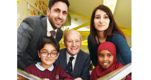 Hash Ejaz, principal consultant at Now Education with school governors' chair Cecil Knight and deputy headteacher Shahin Fazil, with school children Bilal Hussain and Sabah Ahmed